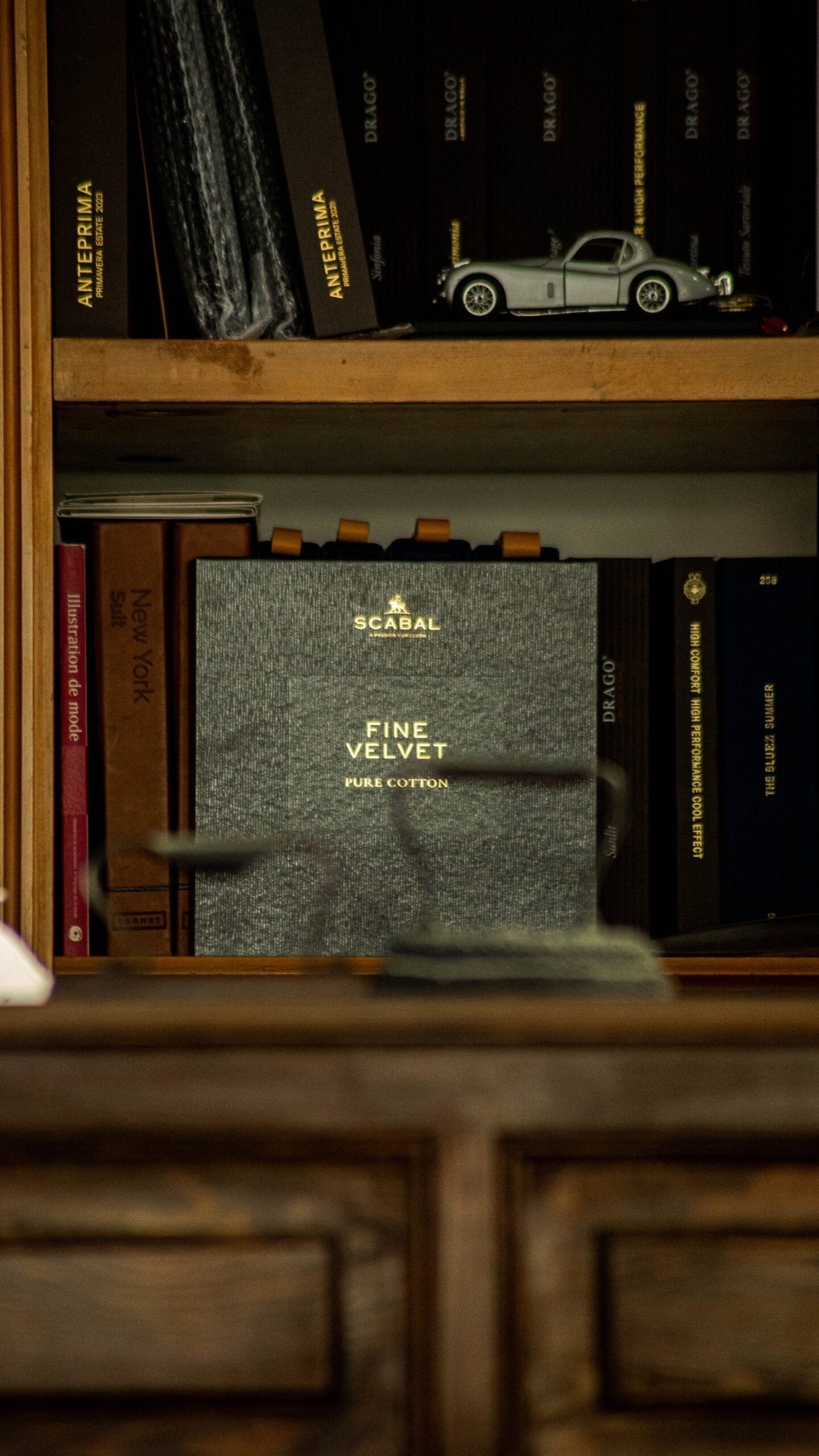 article / bespoke fabrics Scabal cloth volumes on the atelier shelf